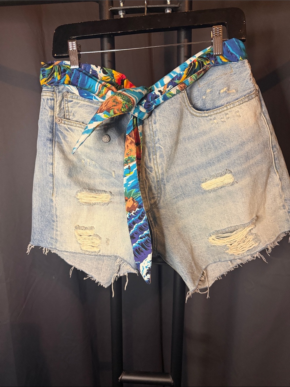 R13 Light Wash Distressed Denim Shorts with Tropical Scarf Belt Attached.